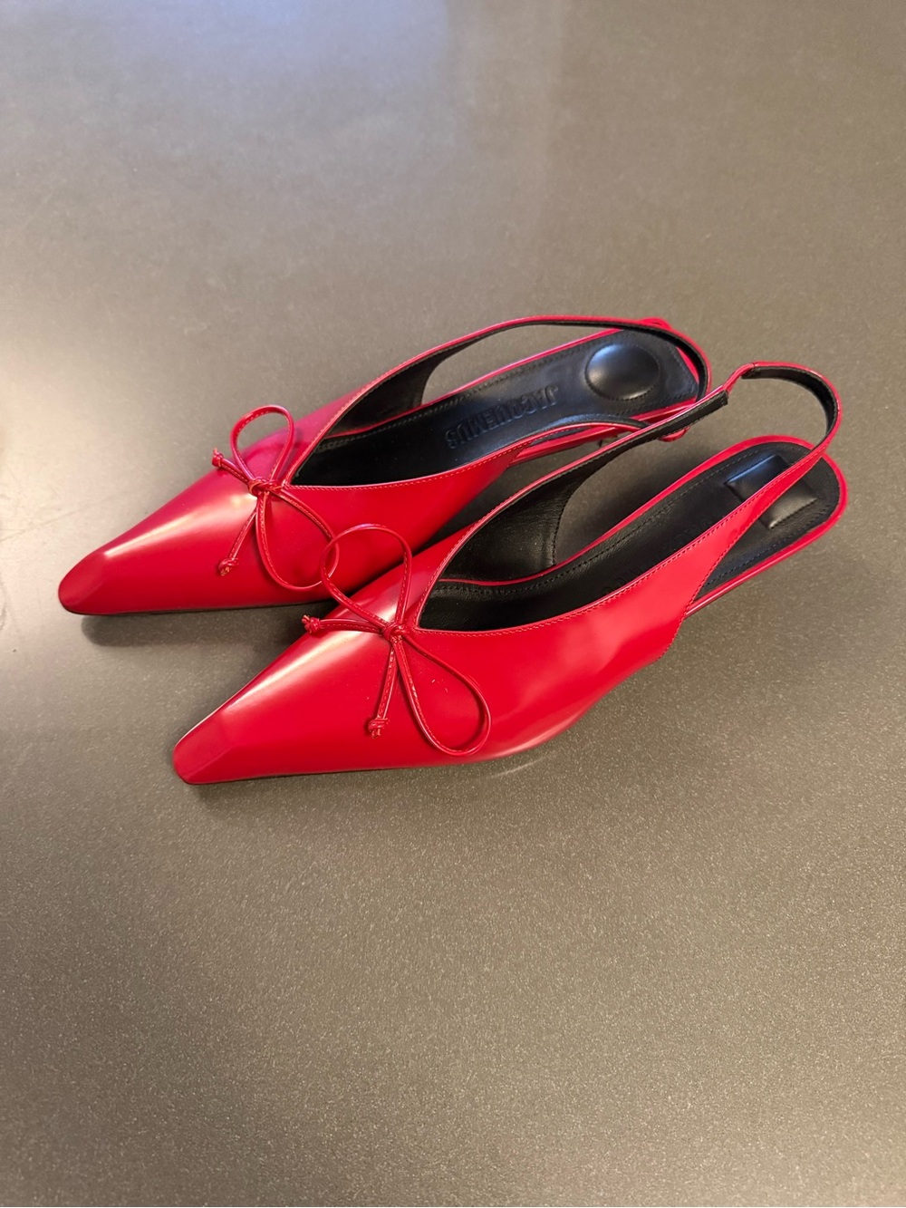 Jacquemus red patent leather pumps.